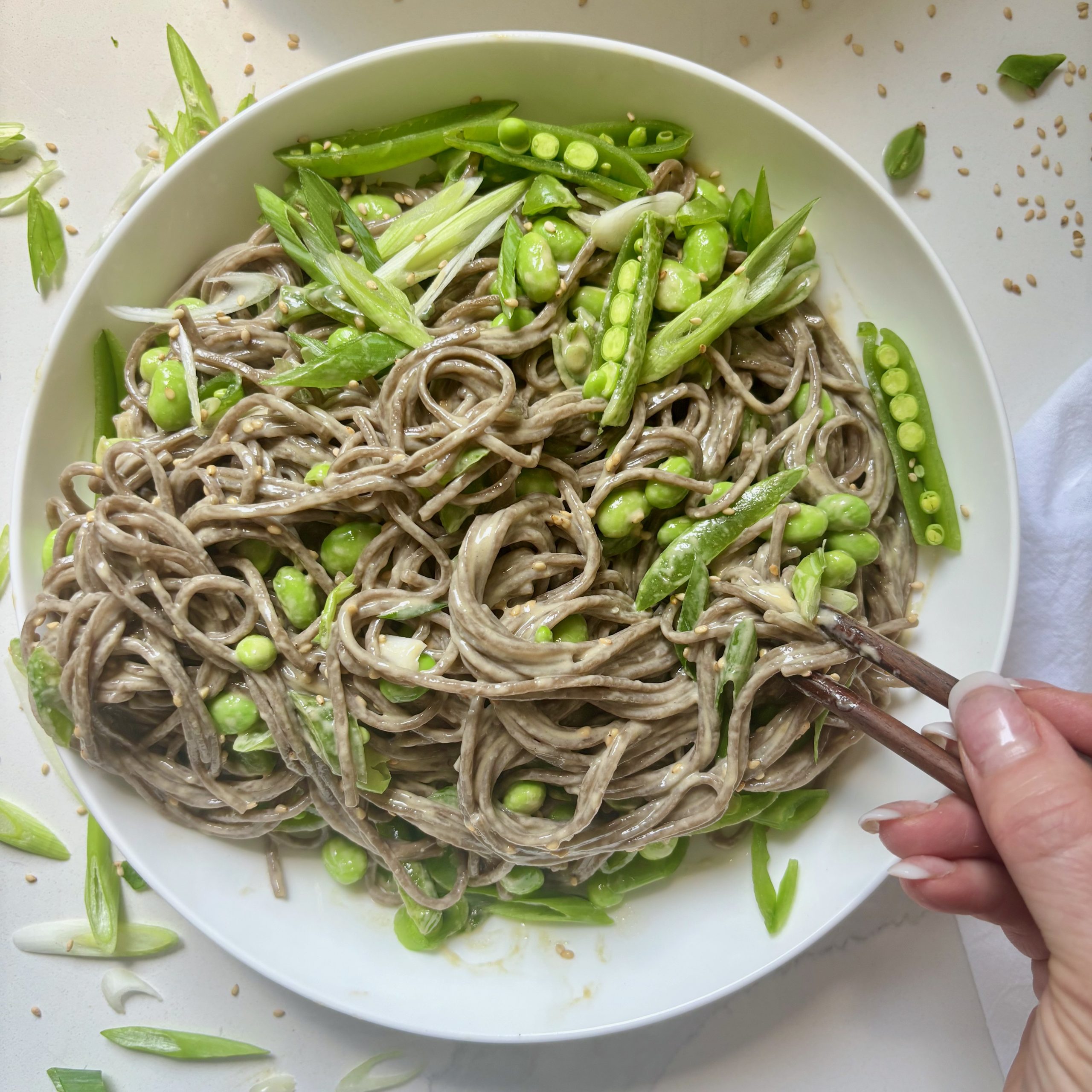 Easy Cold Soba Noodles with Edamame eaten with chopsticks
