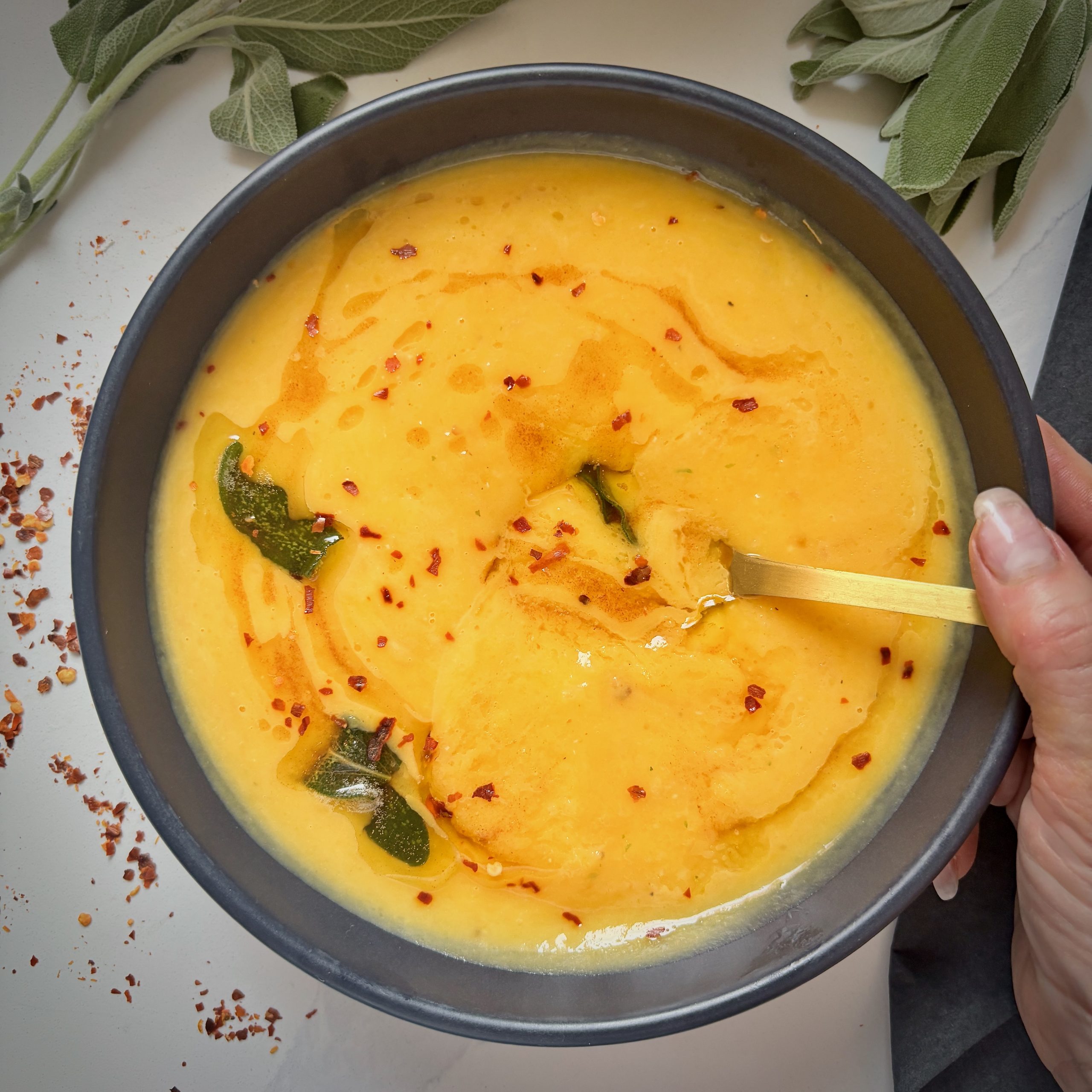 Creamy butternut squash soup in bowl