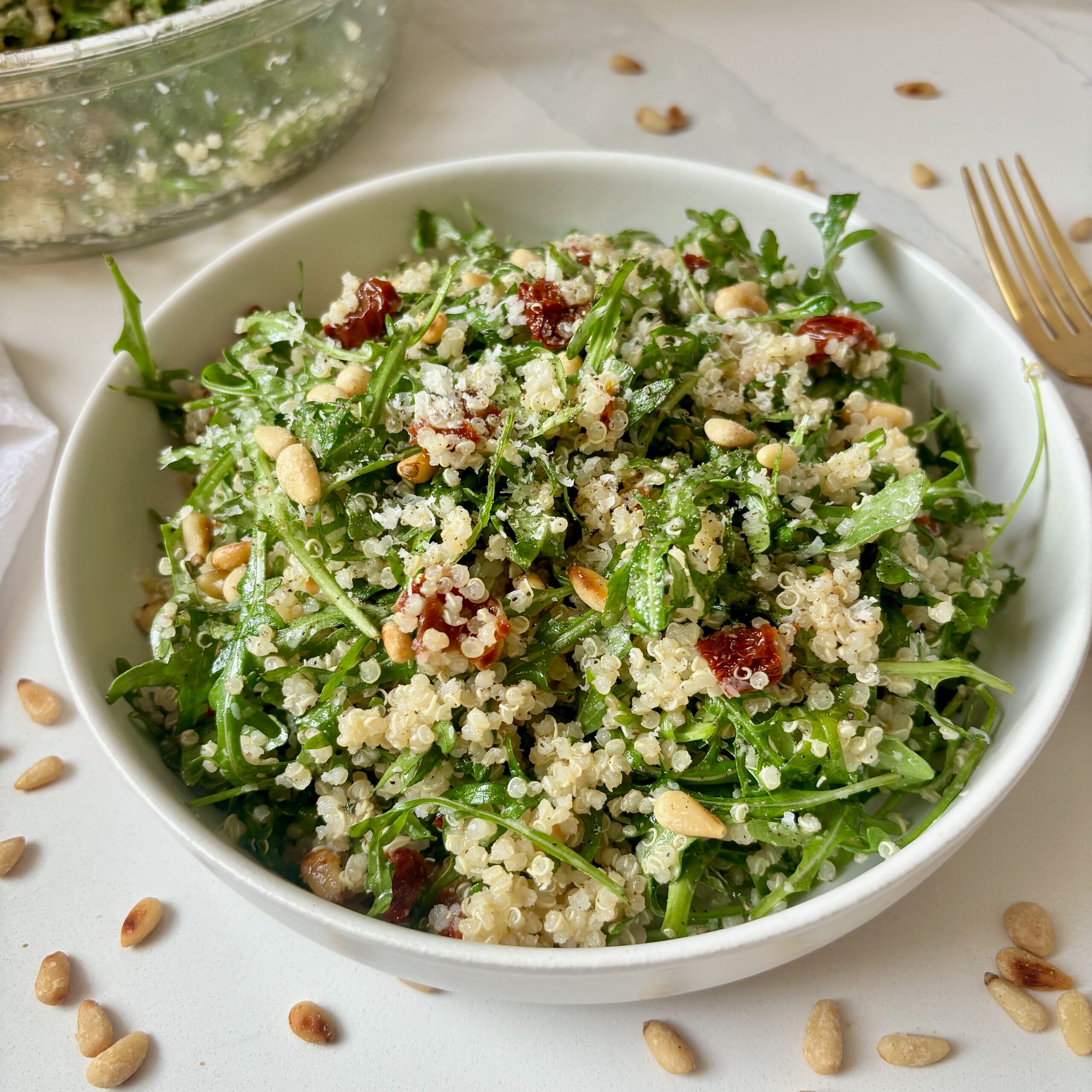 Fresh quinoa salad with toasted pine nuts and grated parmesan