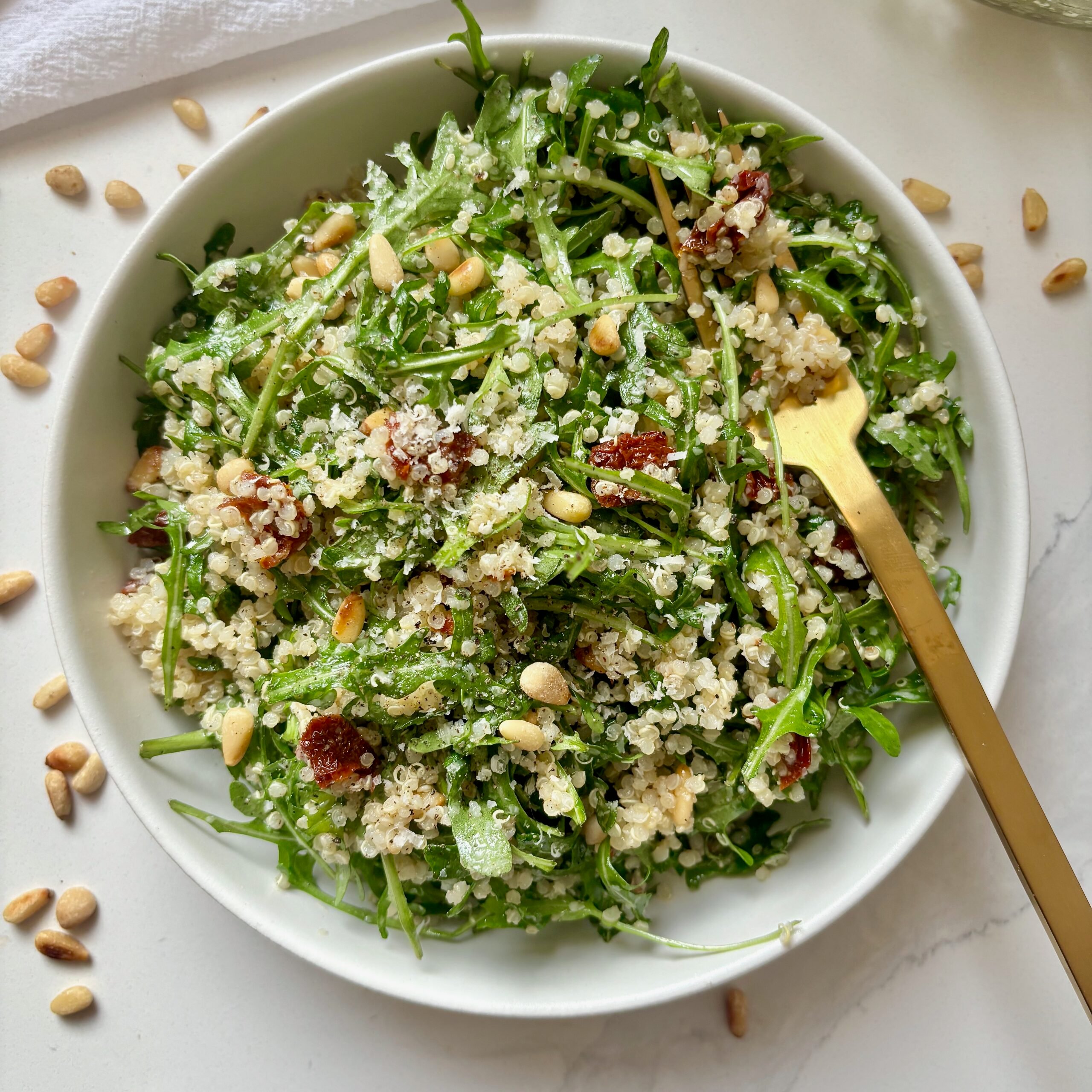 Quinoa Arugula Salad with pine nuts and sun-dried tomatoes