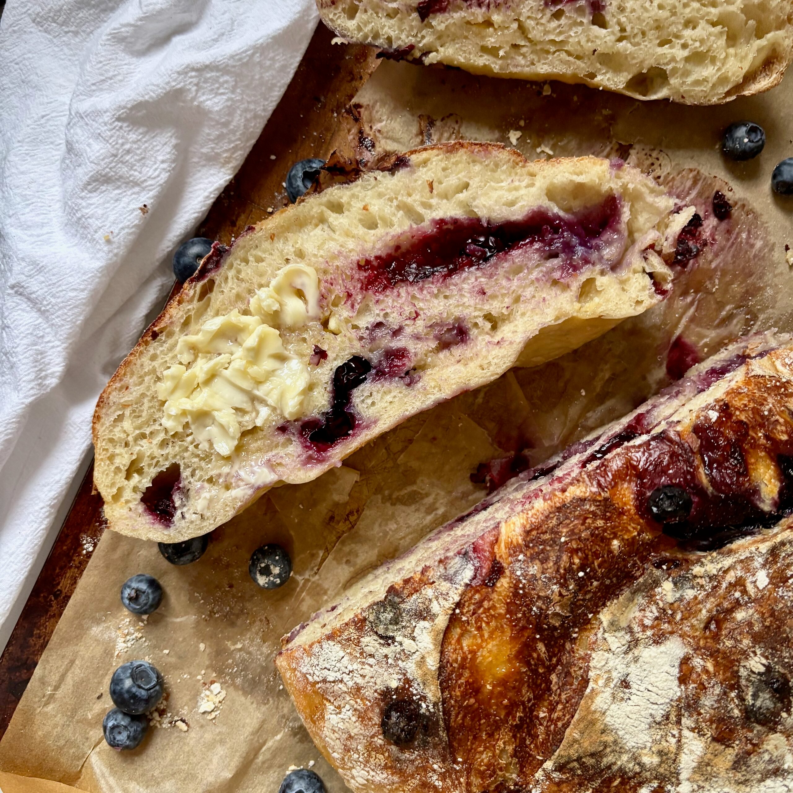 Slice of jammy Blueberry Sourdough Bread with White Chocolate