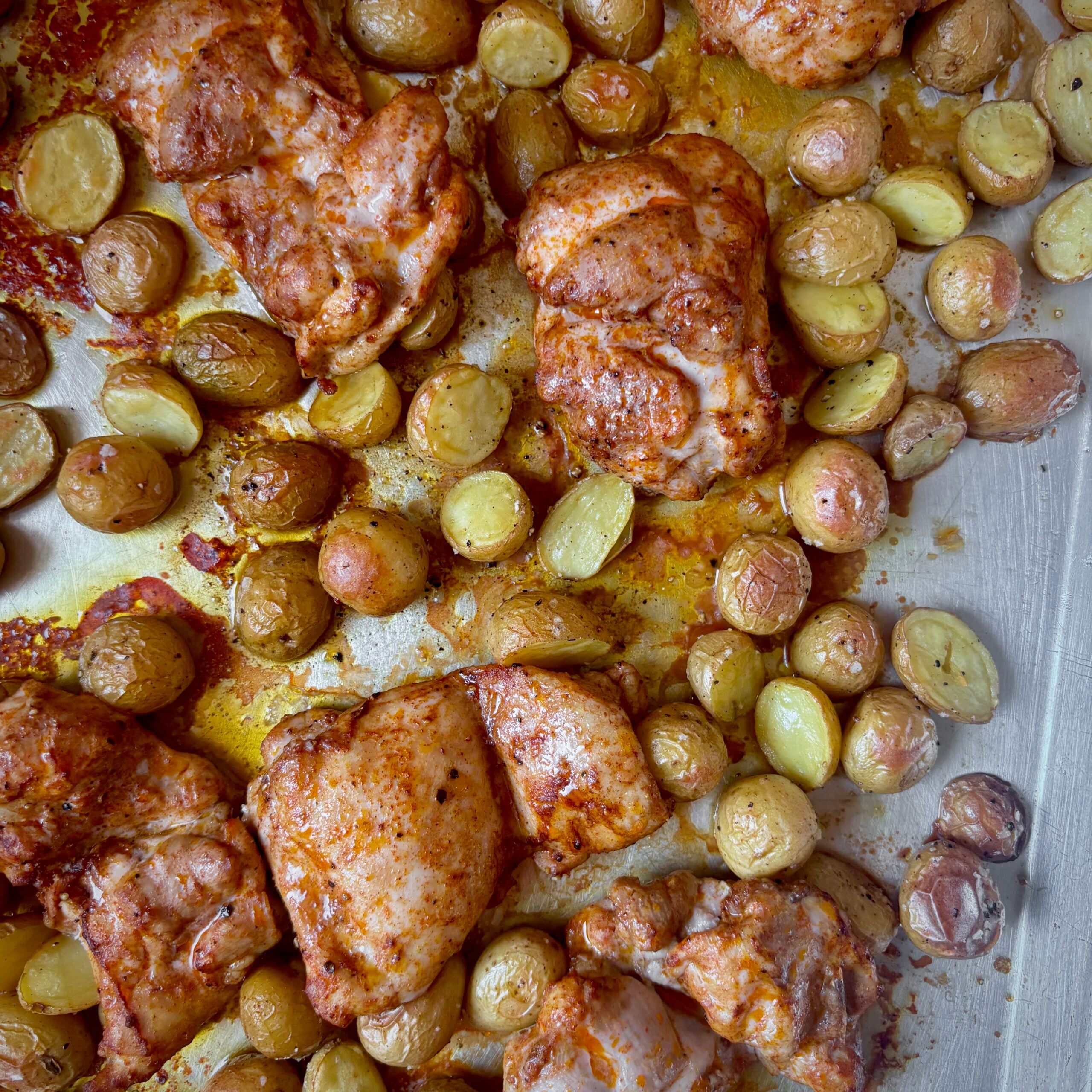 Sheet pan chicken and roasted baby potatoes fresh from the oven