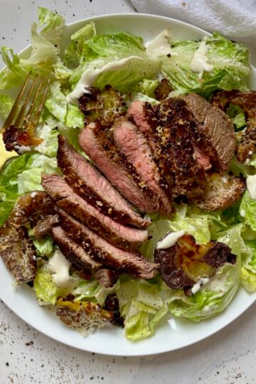 Steak Caesar Salad with Garlic Parmesan Smashed Potato Croutons