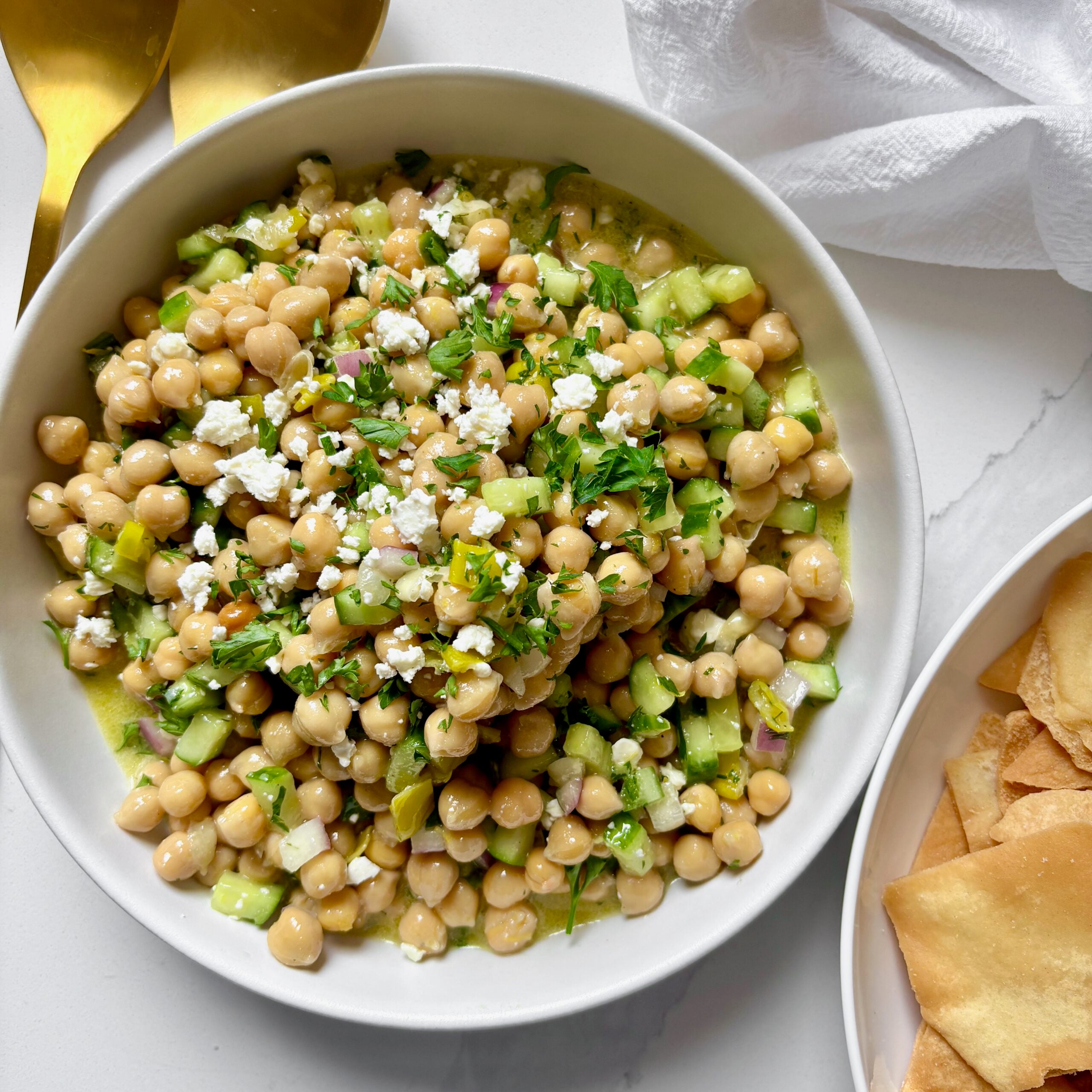 Marinated Chickpea salad with lemon and feta served with pita chips