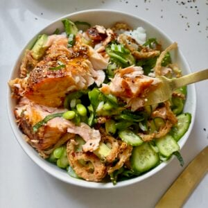 Crunchy Salmon Rice Bowls with avocado, crispy onions, sesame seeds, and rice.