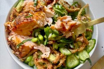 Crunchy Salmon Rice Bowls with avocado, crispy onions, sesame seeds, and rice.