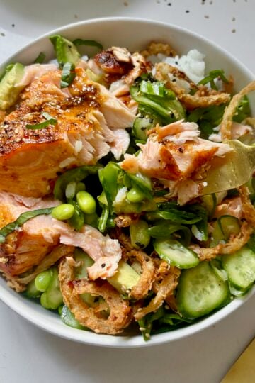 Crunchy Salmon Rice Bowls with avocado, crispy onions, sesame seeds, and rice.