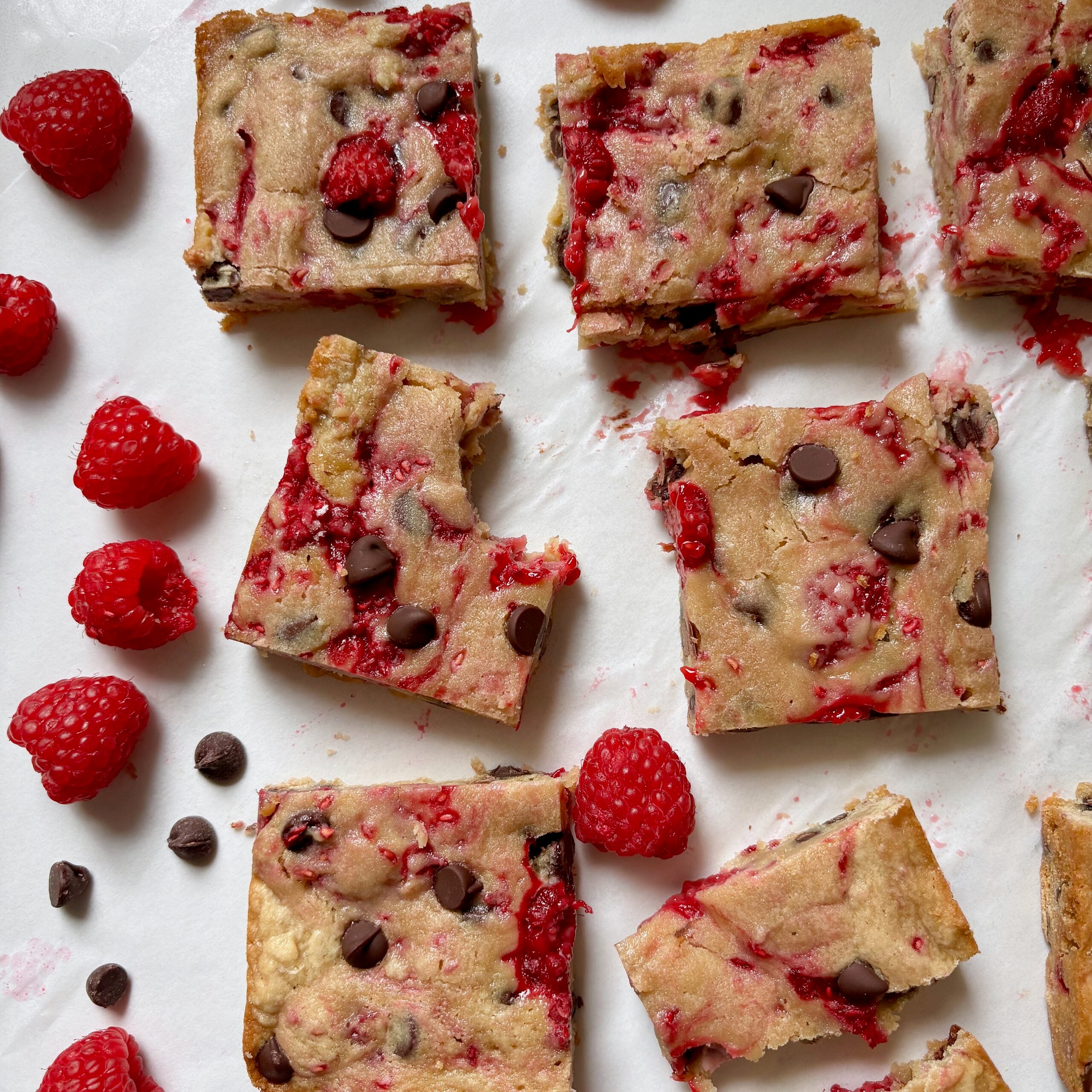 Easy homemade blondies with dark chocolate and fresh raspberries.