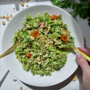 Super Chop Broccoli Salad with edamame and miso ginger dressing served in a white bowl.