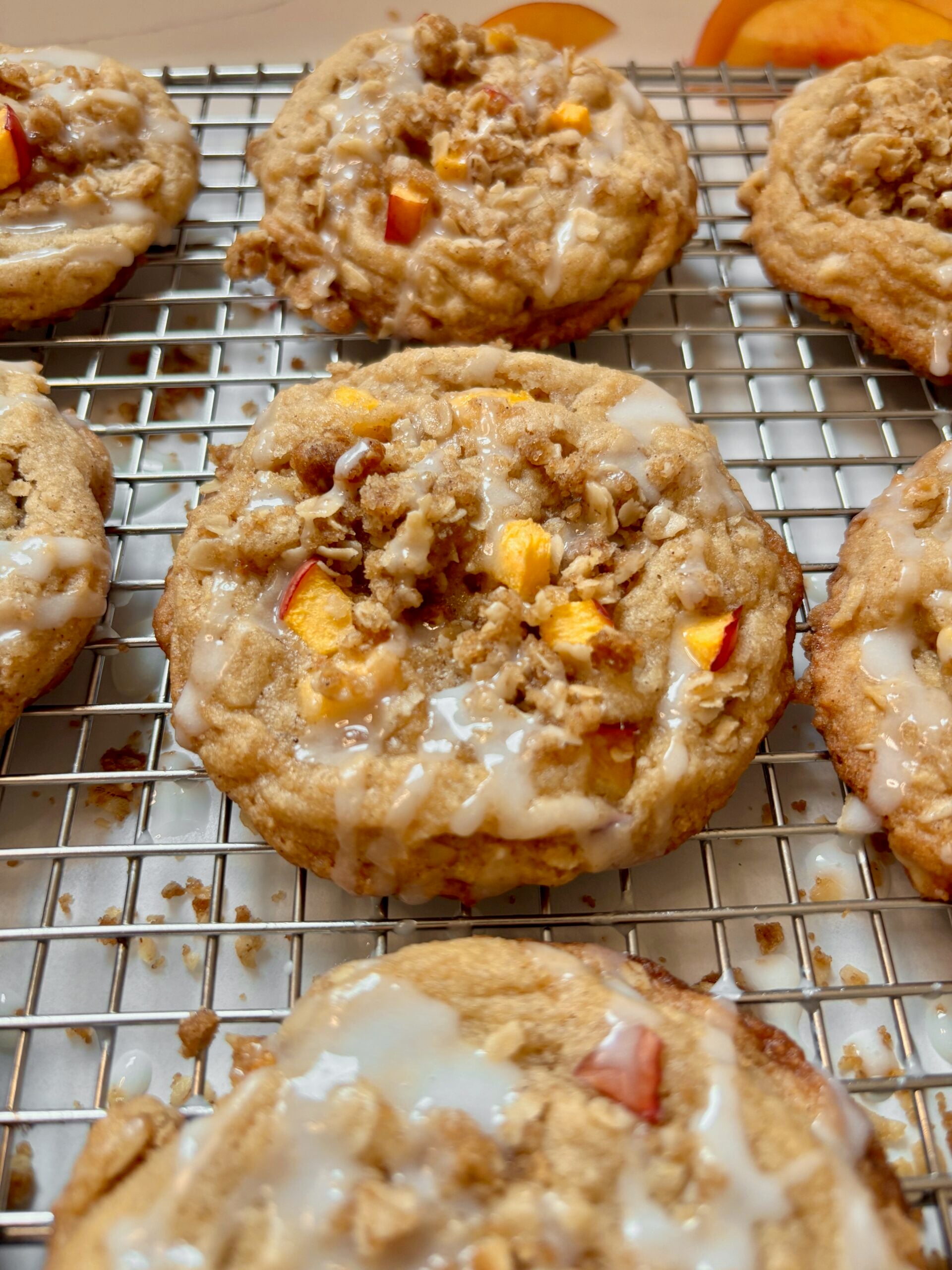 Close-up of chewy peach cookies with almond drizzle