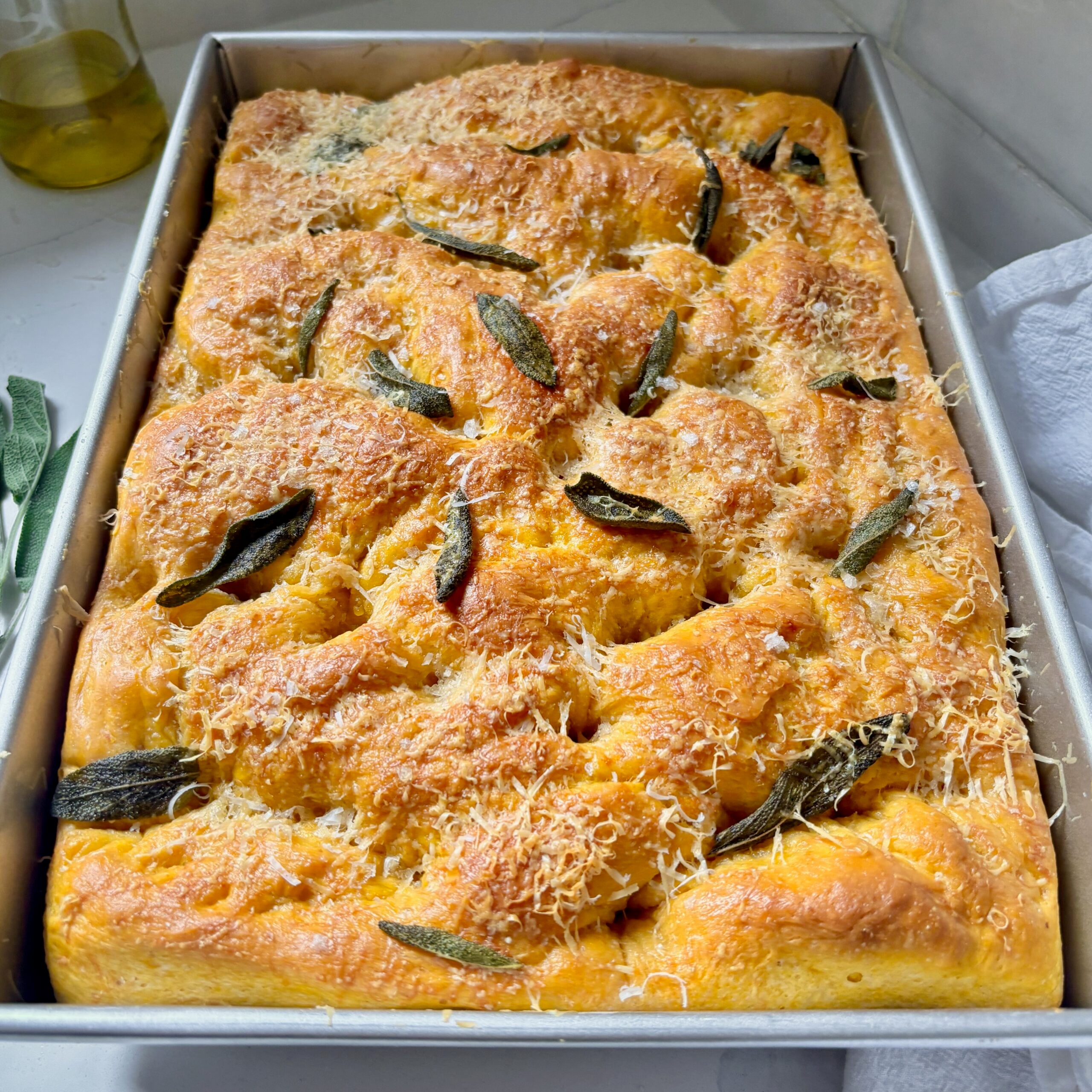 Pumpkin focaccia with crispy sage and Parmesan baked in a 9×13-inch pan