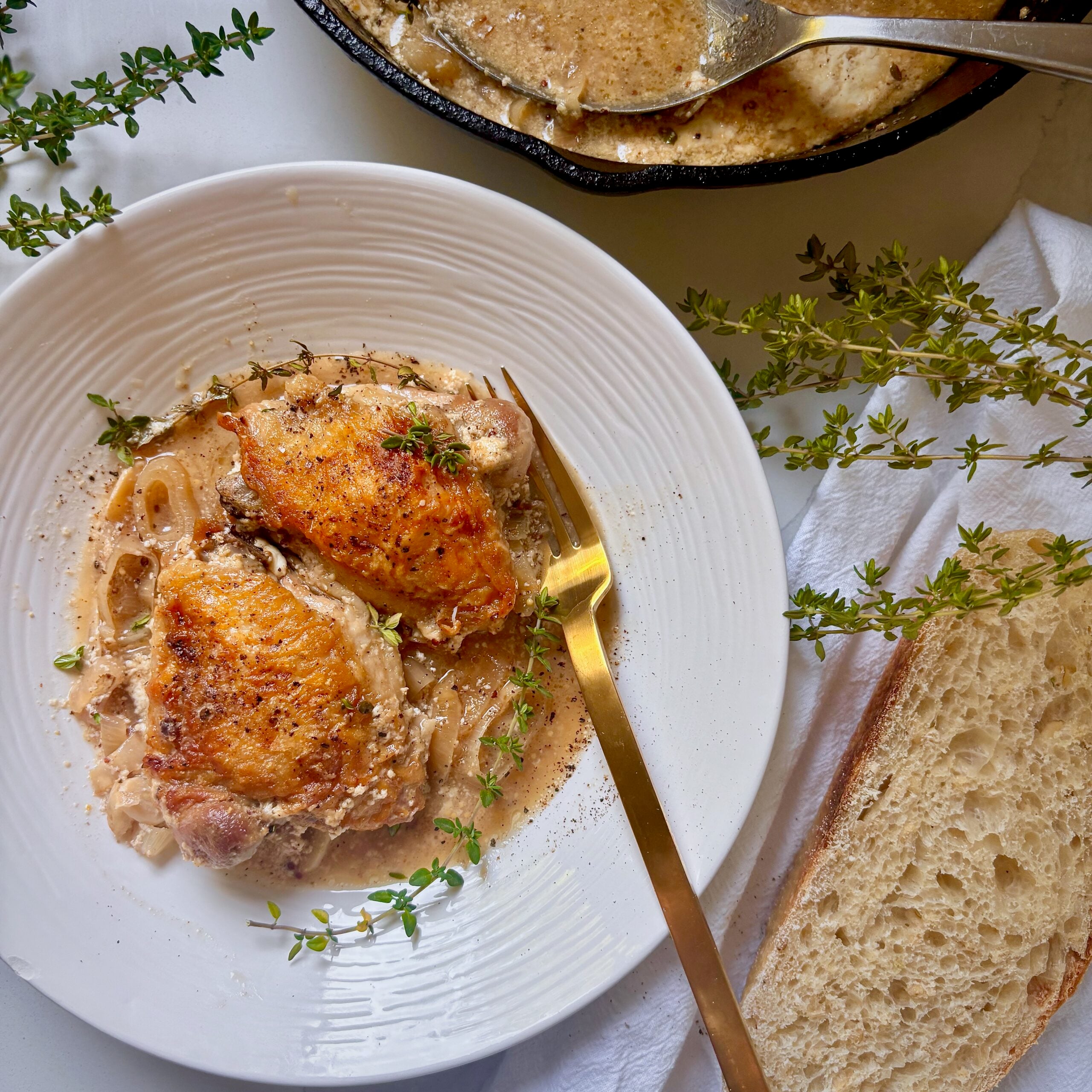 Cast iron braised chicken thighs in buttermilk, dijon, white wine sauce