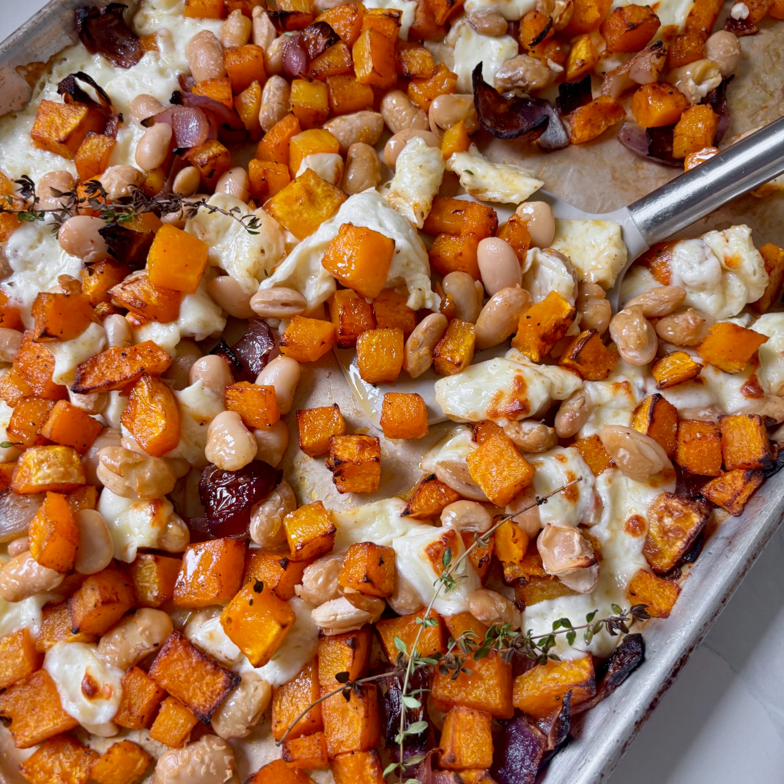 Vegetarian sheet pan dinner with butternut squash, butter beans and halloumi