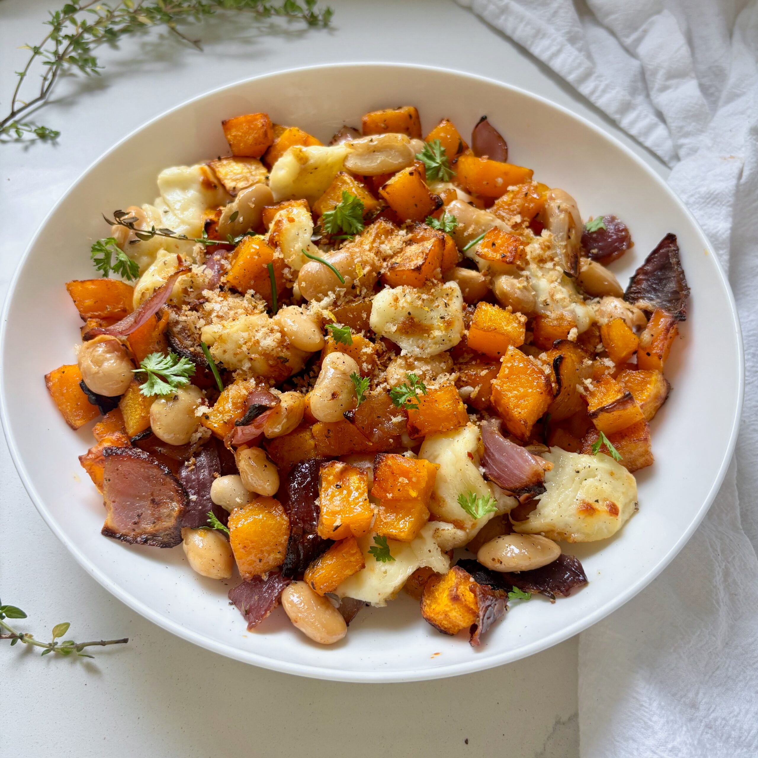 Golden halloumi and roasted butternut squash topped with crispy lemon garlic panko