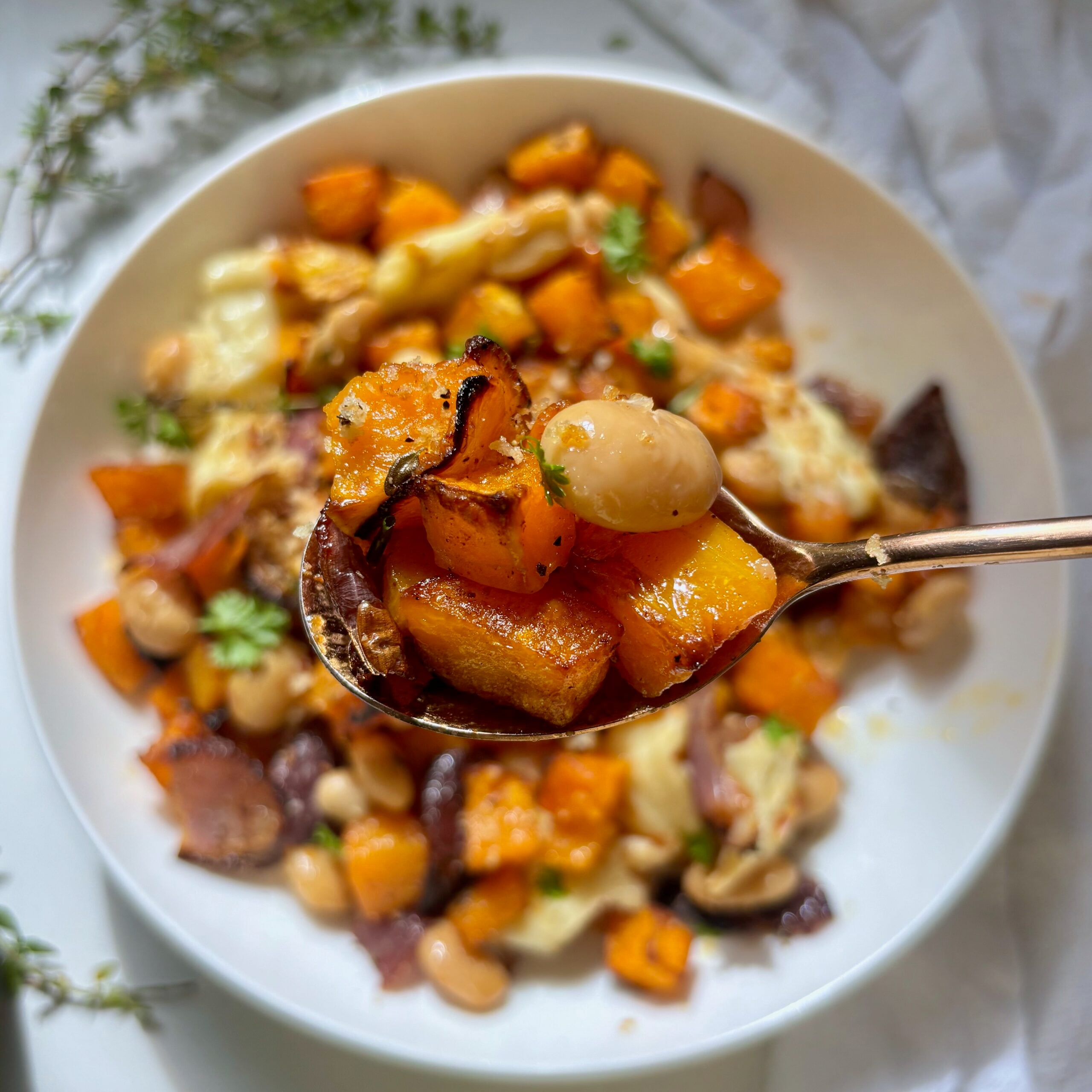Spoonful of Golden halloumi and roasted butternut squash topped with crispy lemon garlic panko