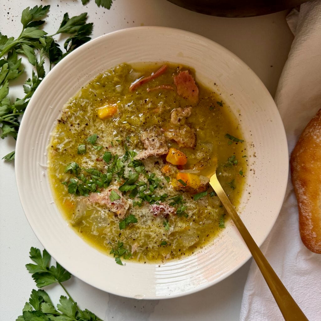 Rustic split pea and ham bone soup finished with Parmesan cheese, red pepper flakes and fresh herbs.
