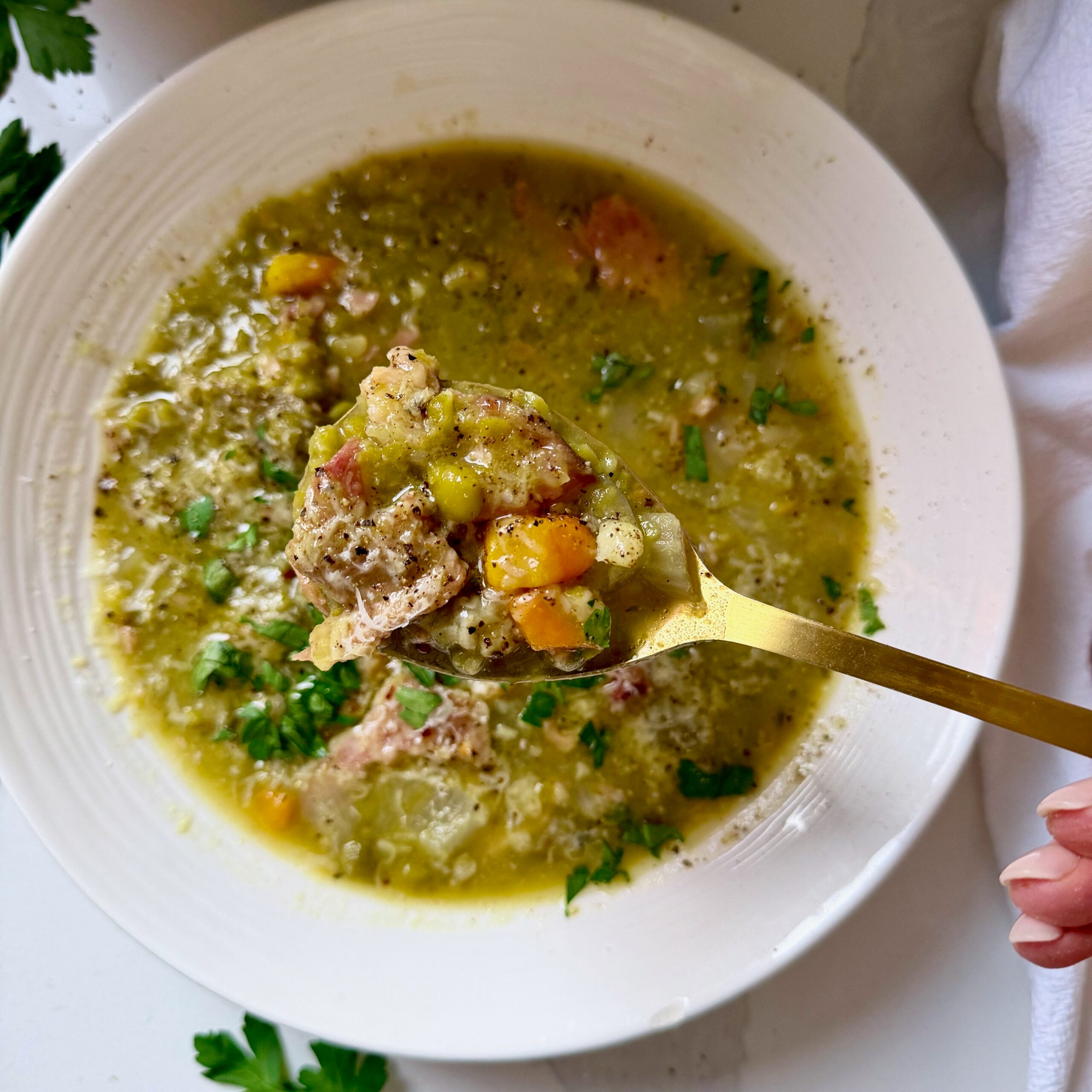 Hearty green split pea soup with carrots, celery, tender ham and a spicy butter topping.