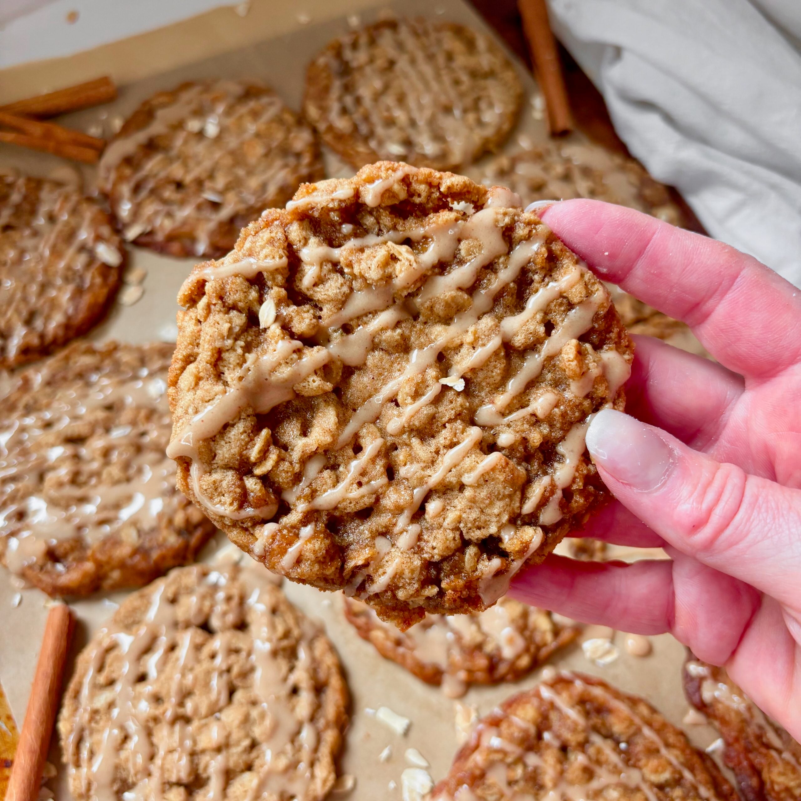 Close-up of soft and chewy maple oatmeal cookie with spiced glaze